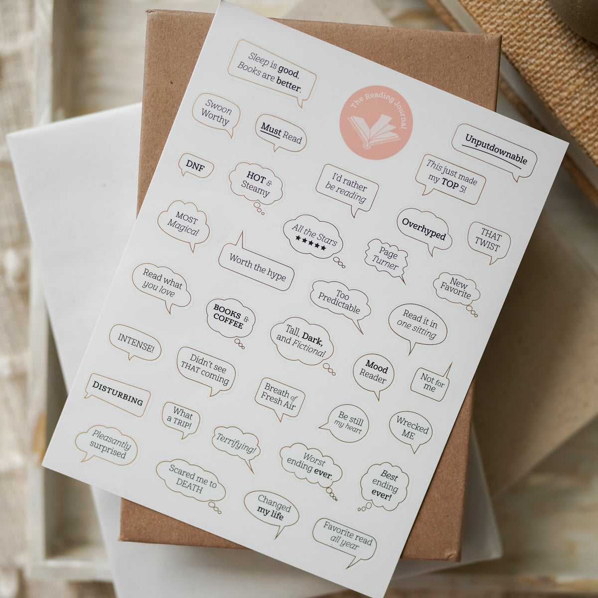 Reading Journal Sticker Sheet are white stickers with gold bubbles around them and phrases