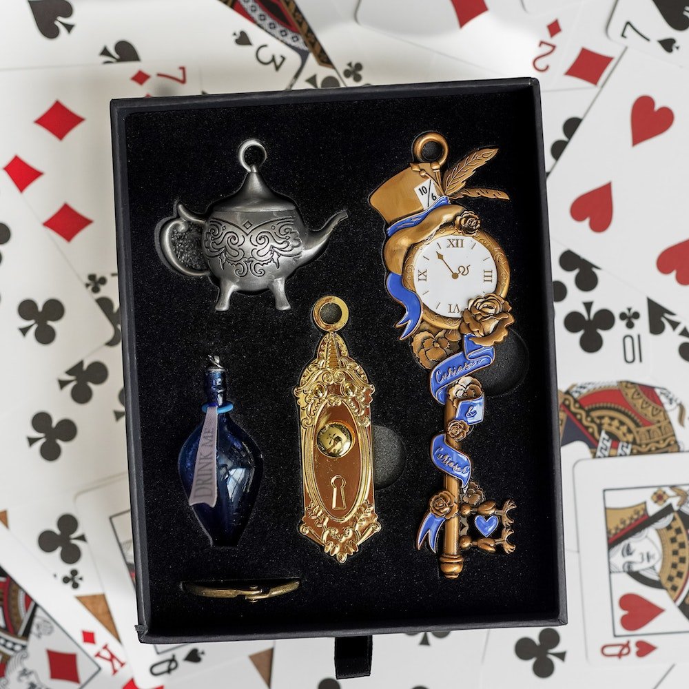 Alice in Wonderland Key with Door Knob, Mad Hatter Teapot, and Glass Bottle charms.