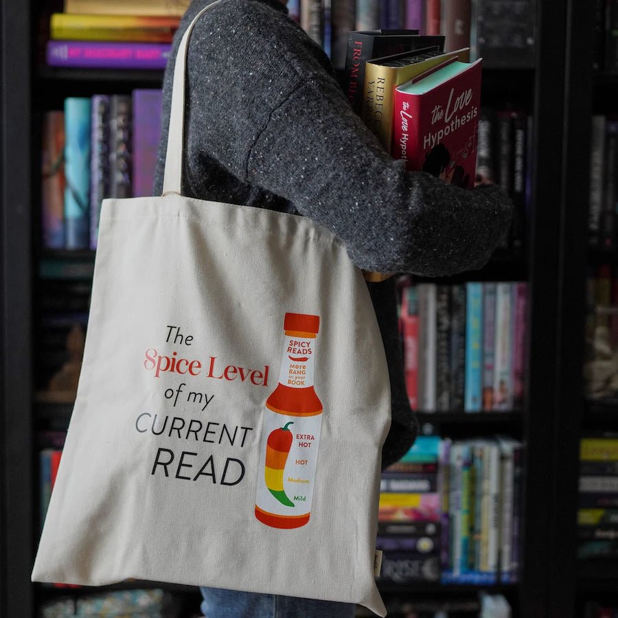 Hot Sauce Spicy Reader Tote is a tote bag shaped like a hot sauce bottle ranging from mild to extra hot with a chili pepper enamel pin