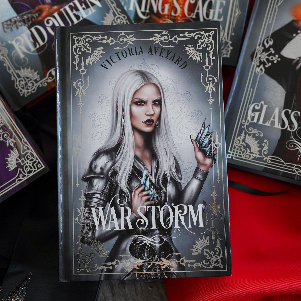 War Storm book 4 featuring Evangeline wearing metal to use her magnetron ability, as well as holding a broken crown.