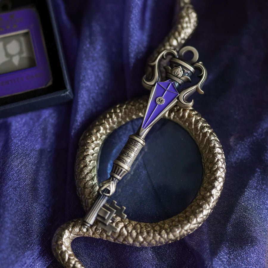 Silver &amp; purple metal Wizard Government Key with engraved &quot;M.&quot; Comes with Ministry Identity Card charm and purple pouch with the words &quot;Speak clearly. Ministry issued powder.&quot;