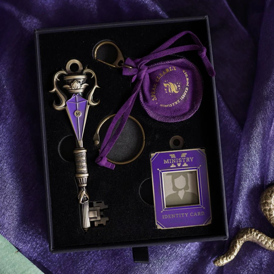 Silver &amp; purple metal Wizard Government Key with engraved &quot;M.&quot; Comes with Ministry Identity Card charm and purple pouch with the words &quot;Speak clearly. Ministry issued powder.&quot;