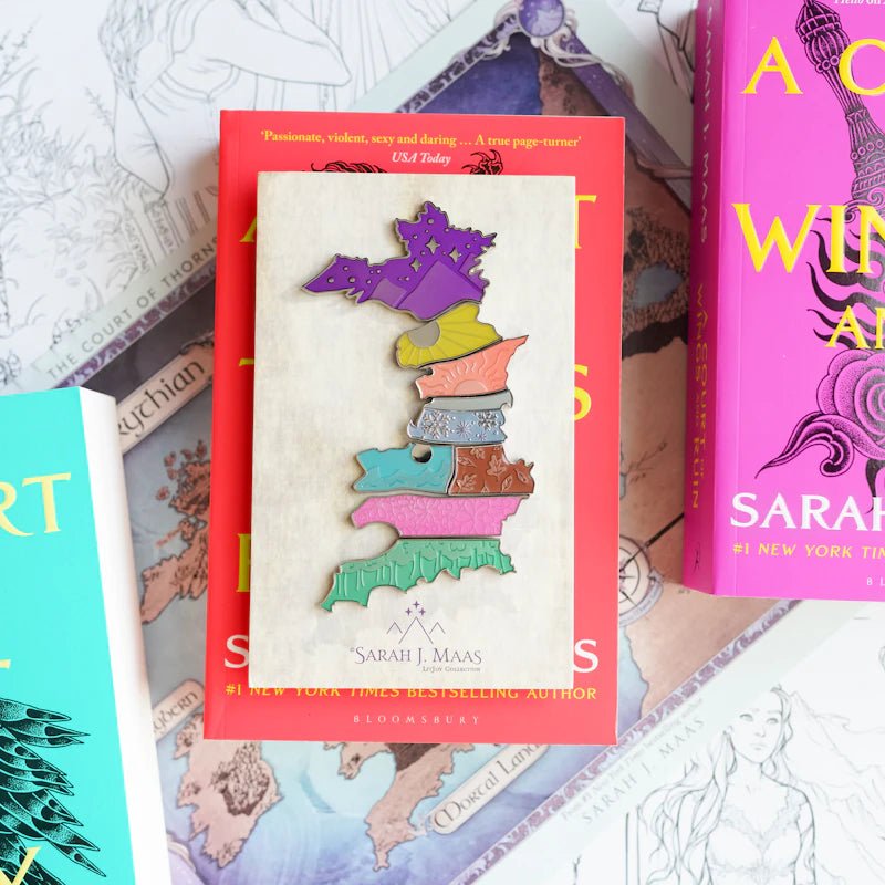 ACOTAR Map of Prythian Enamel Pin Set includes 8 vibrant-colored pins representing the courts, creating the map of Prythian.