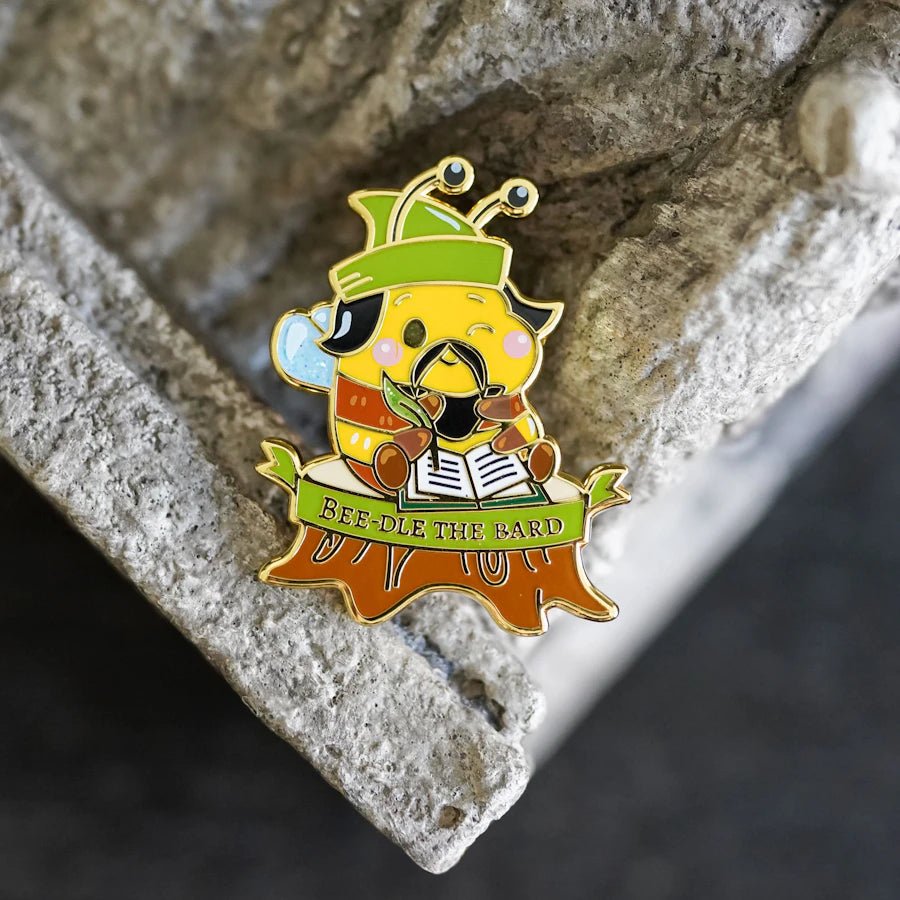 Bee-tle the Bard Enamel Pin is an adorable bumblebee version of our favorite fictional storyteller for your pin collection!