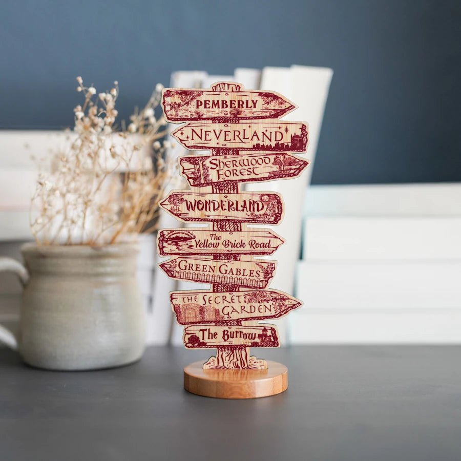 Wooden bookish signpost for your shelf pointing to various literary worlds such as Green Gables, Neverland, and more