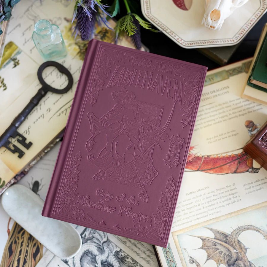 Fablehaven: Grip of the Shadow Plague has debossed illustrations on a leatherette cover, mystical endpapers, and gilded edges