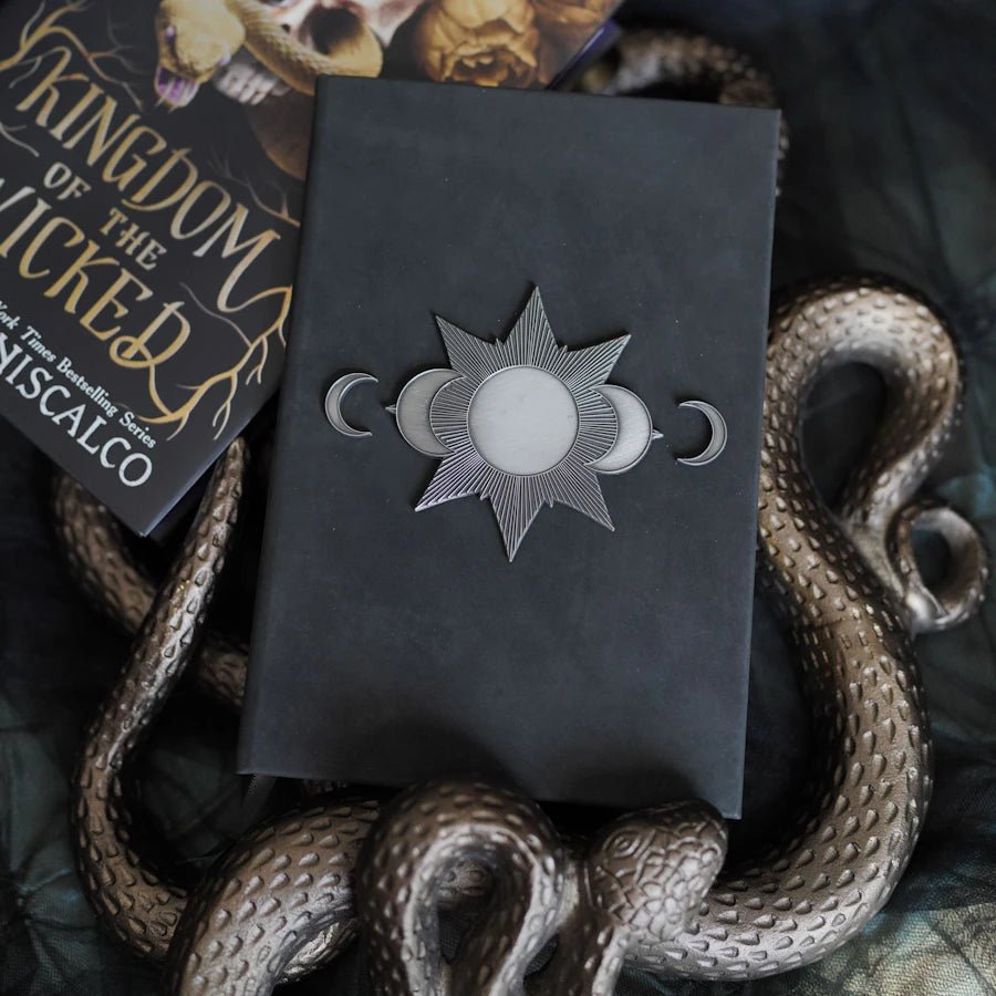 Kingdom of the Wicked La Prima&#39;s Grimoire Replica Notebook with moon metal detail, aged faux leather, &amp; 200 blank black pages