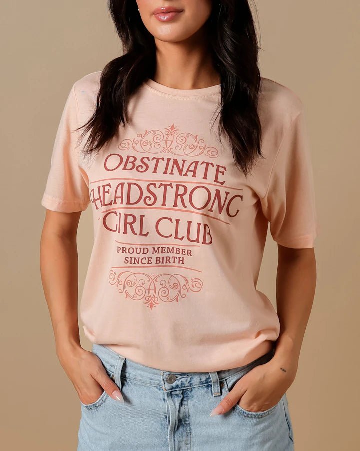 Dust blush colored crew neck Pride and Prejudice shirt with &quot;Obstinate Headstrong Girl Club— Proud member since birth“ design