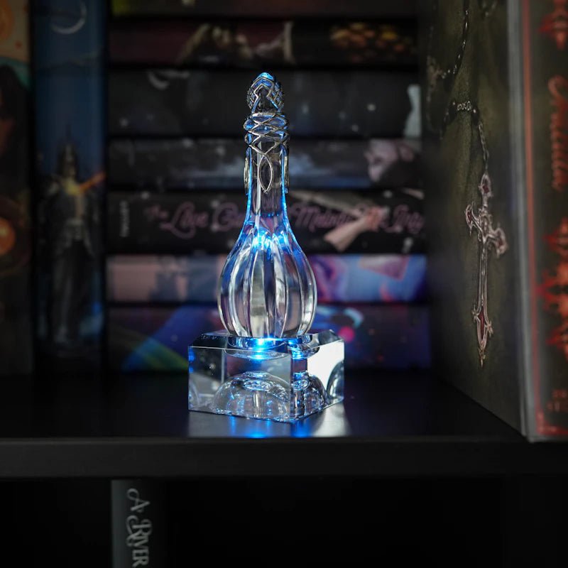 Glass Crystal Starlight Vial on a stand with blue LED light