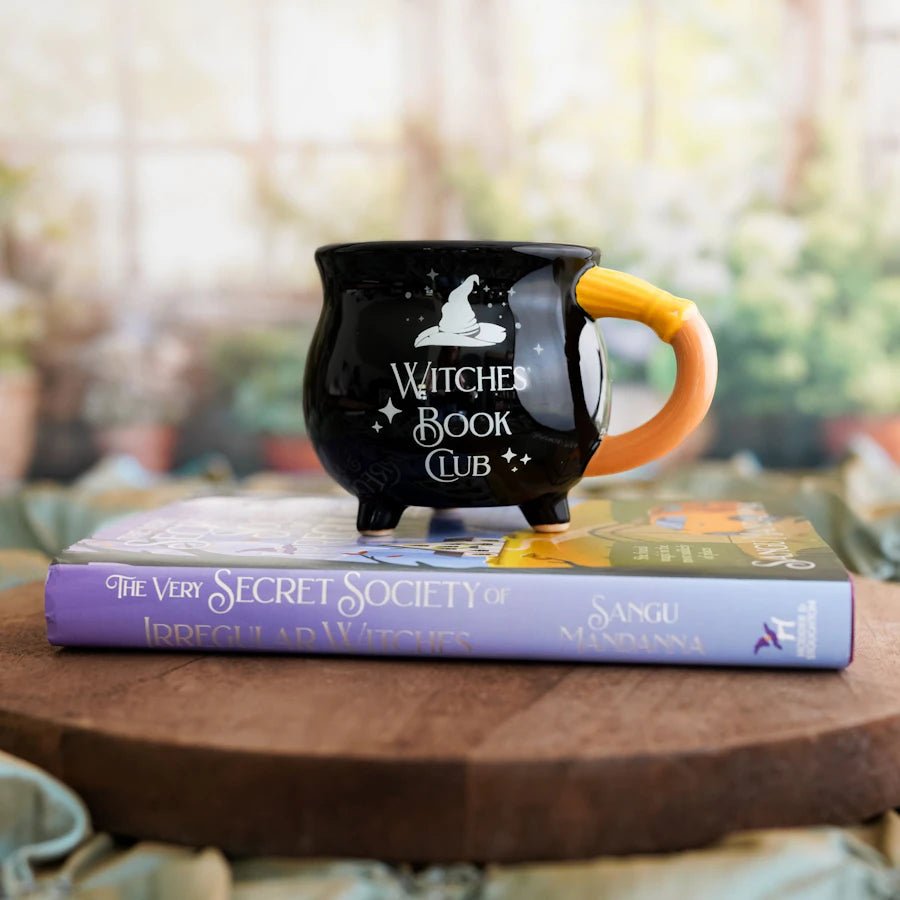 The Very Secret Society of Irregular Witches Book Club Mug - a cauldron with a witch hat above the words: Witches&#39; Book Club