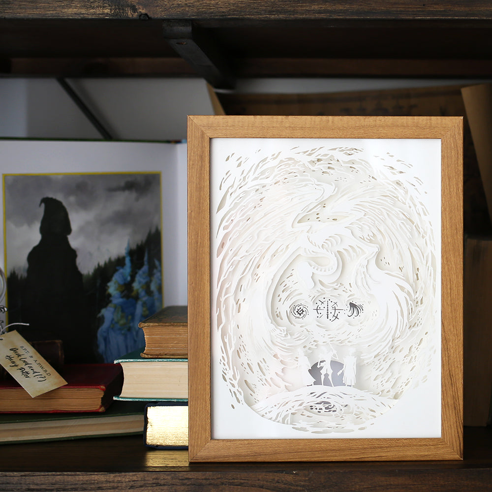Brothers Light Box is a framed paper cut design of a monster/death above three brothers.
