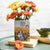 Anne of Green Gables Book Vase features the cover of LitJoy Classics book and Anne in a flower field with Green Gables