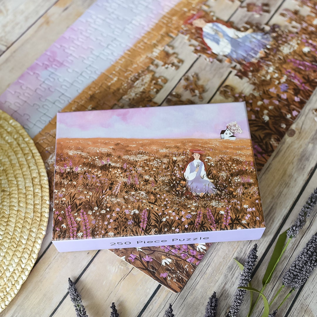 Anne of Green Gables Puzzle with 250 pieces showing Anne Shirley in flowery field with Green Gables in the distance