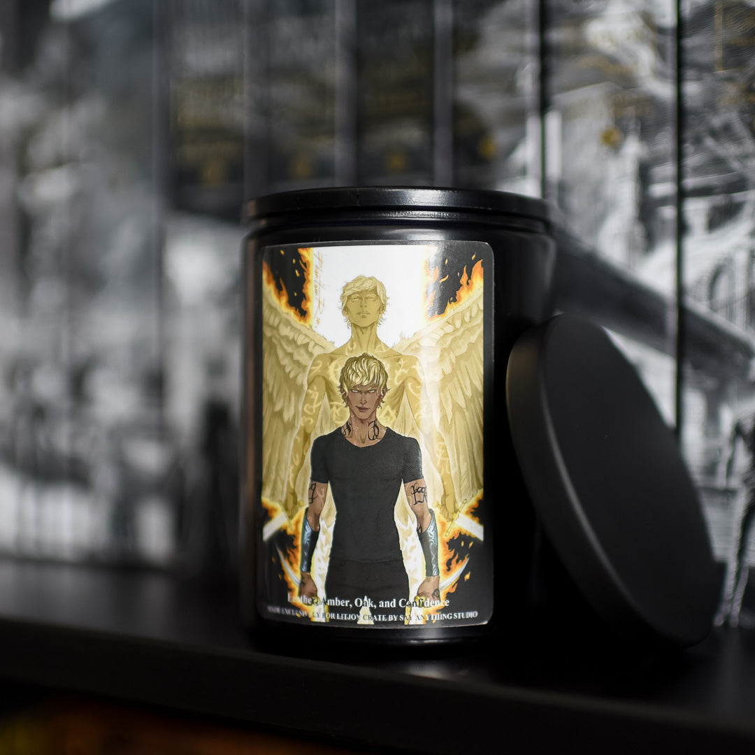 Jace Saint Candle in black with fan art of Jace Herondale with runes and an angelic depiction with fiery wings behind him. 