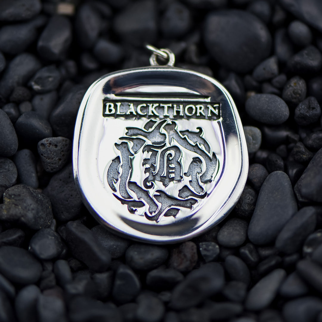 Shadowhunter Family Crests Necklace Charm is from The Mortal Instruments series and has a silver crest of Blackthorn