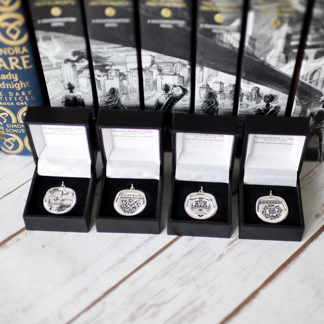 Shadowhunter Family Crests Necklace Charm are silver family crests from the 4 families from the Mortal Instruments series Blackthorn, Carstairs, Lightwood, and Herondale.