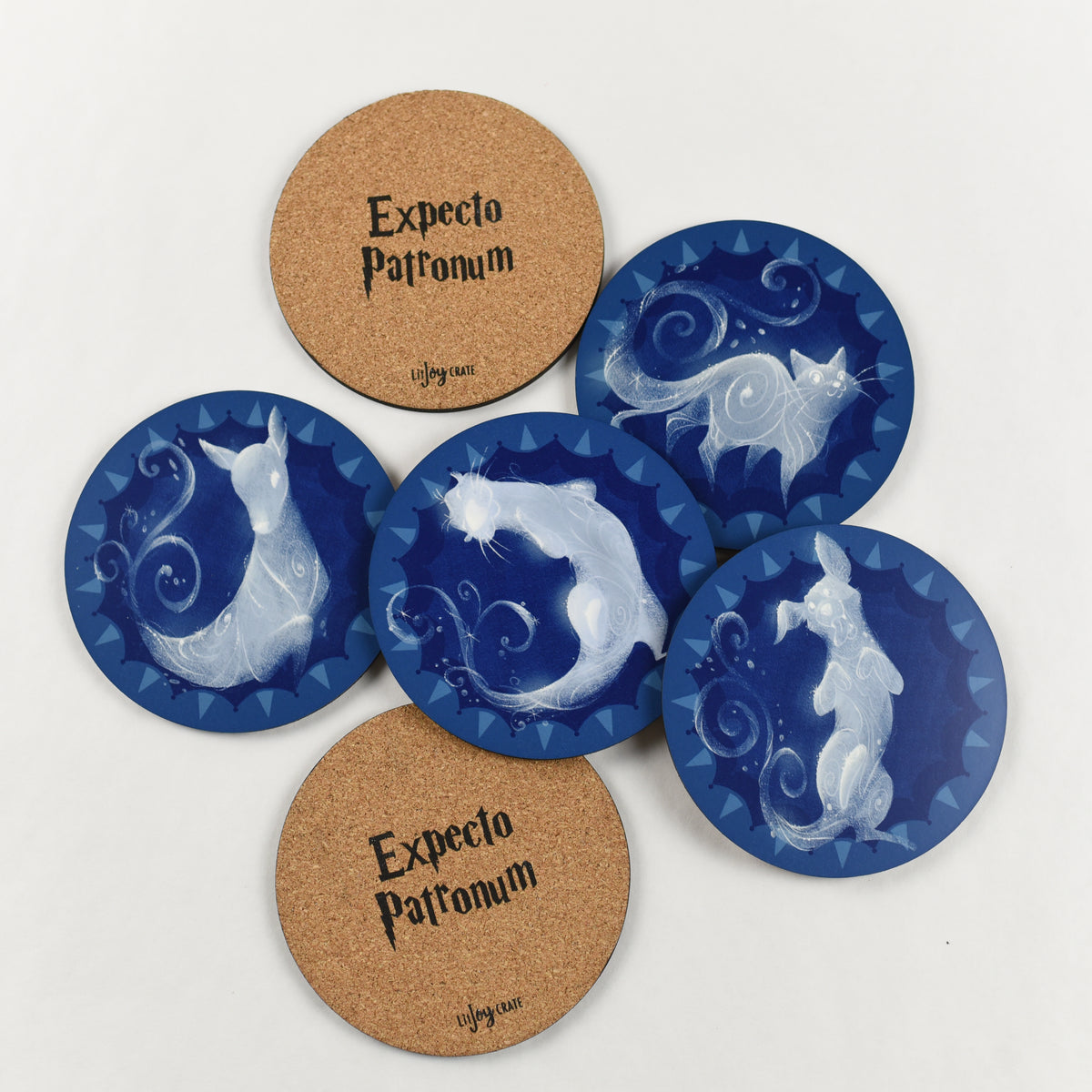 Set of 6 round blue and white Magical Animal Familiar Coasters includes an otter, stag, hare, doe, terrier, and cat.