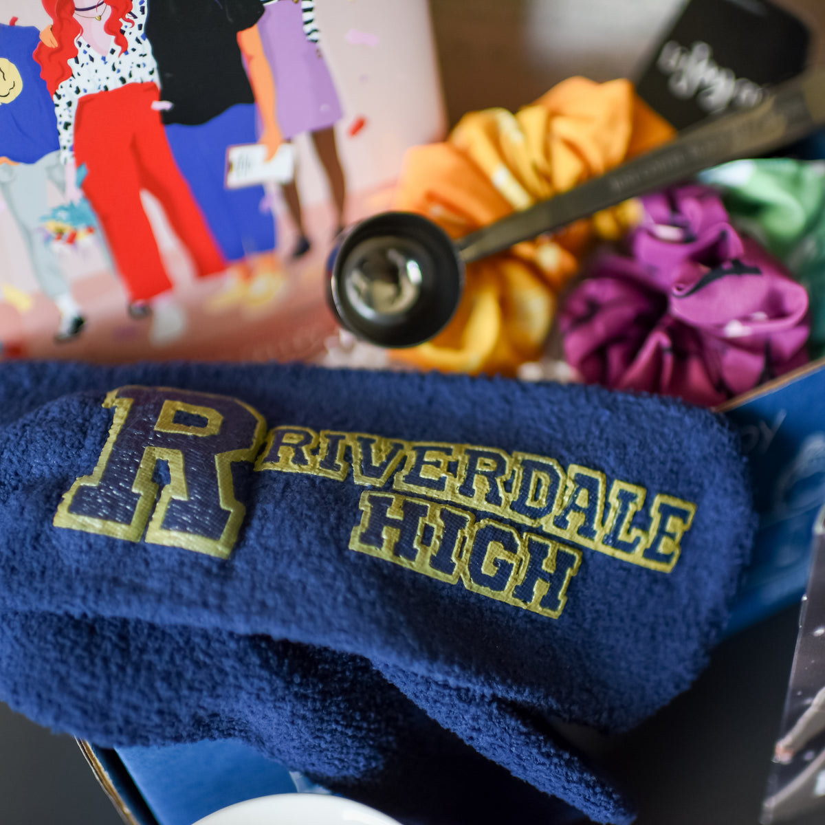 Blue socks featuring the R Riverdale High logo