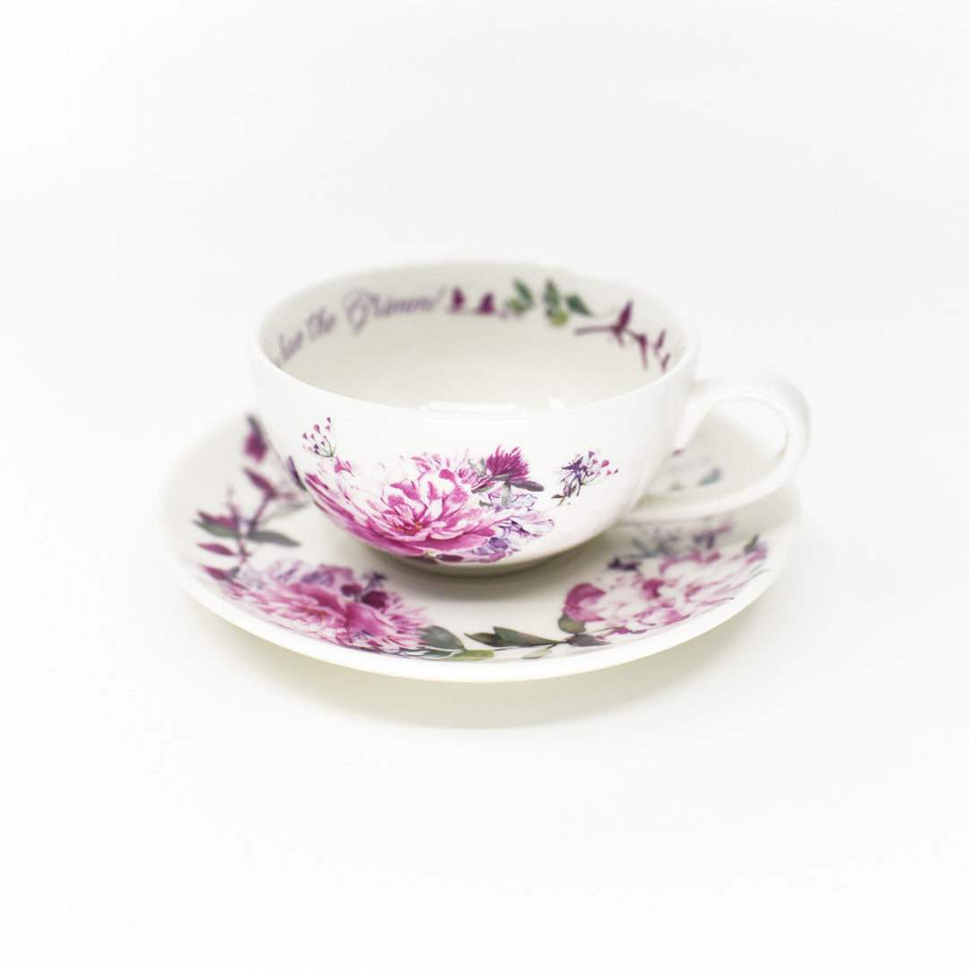 Grimm Teacup and Saucer with pretty violet flowers and a wolf shaped grimm on the inside bottom of the cup