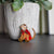 A Little Princess Monkey Critter Collection Enamel Pin of a monkey wearing a red outfit.