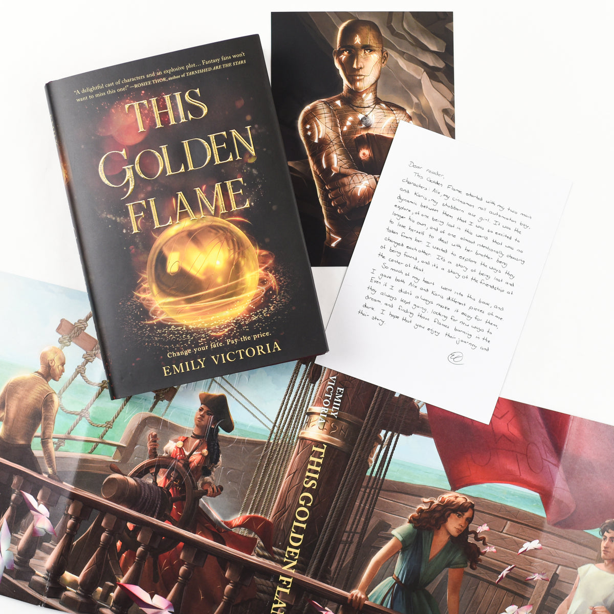 This Golden Flame by Emily Victoria with red stained edges, author signature, fan art on the reversible dust jacket, and author letter.