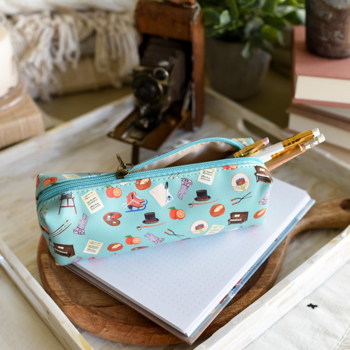 Little Women Pencil Pouch in blue with little icons on a blue pencil case with a zipper