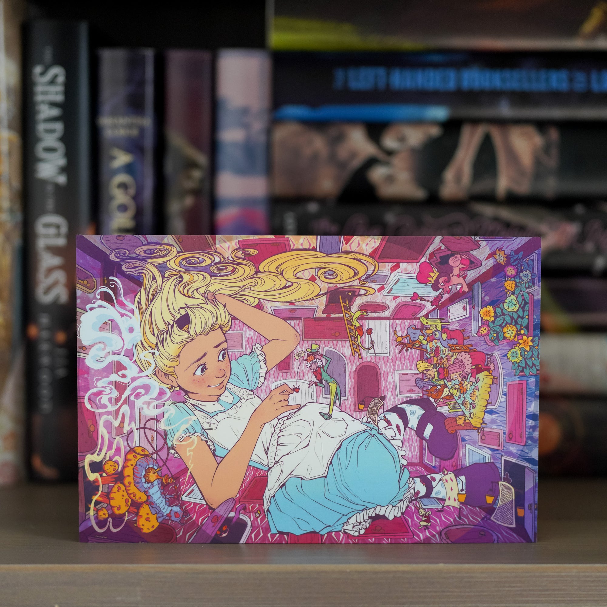 Alice in Wonderland Art Print designed with Alice surrounded by images of characters from the Alice in Wonderland story.