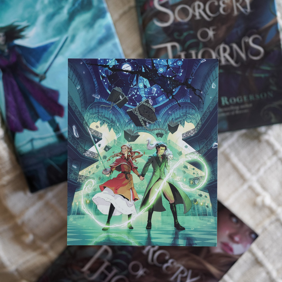 Sorcery of Thorns Art Print includes Elisabeth and Nathaniel with grimoires flying around them