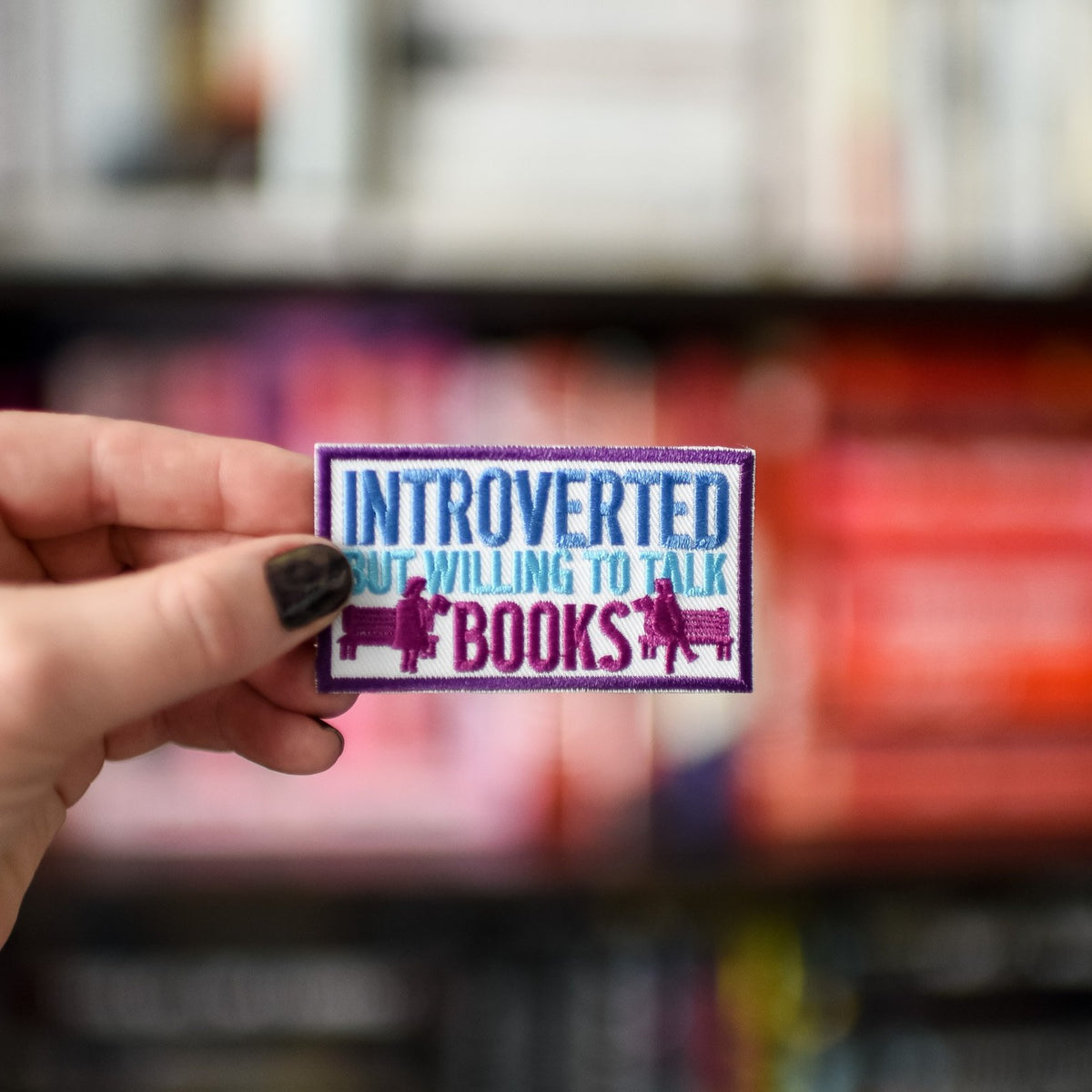 Introvert But Willing to Talk about Books Patch with benches and two people holding books