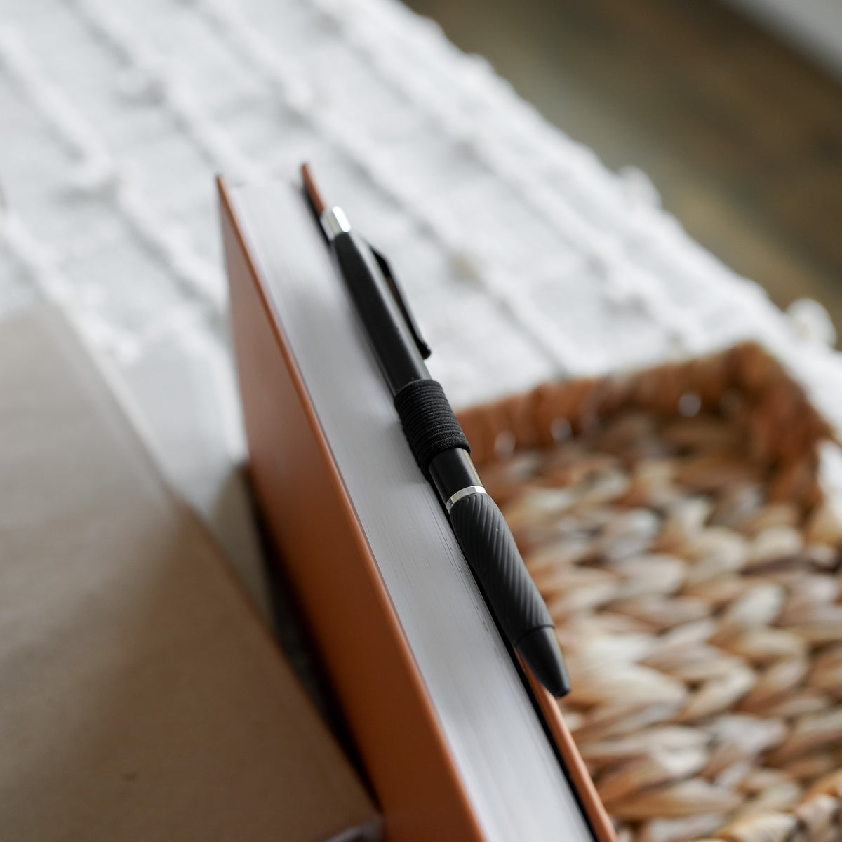 Reading Journal Pen Loop is an elestic black loop that attaches to a journal and holds a pen