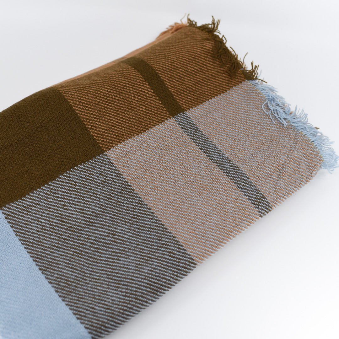 Light blue and brown Tartan Blanket Scarf has fringe edges