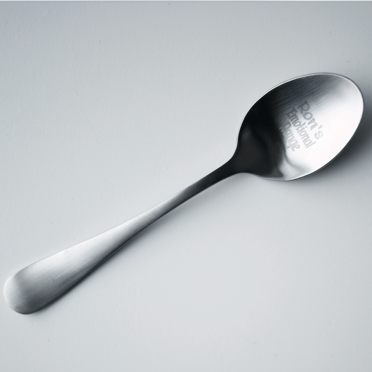 Silver Emotional Range teaspoon engraved with &quot;Ron&#39;s Emotional Range&quot; inside the spoon