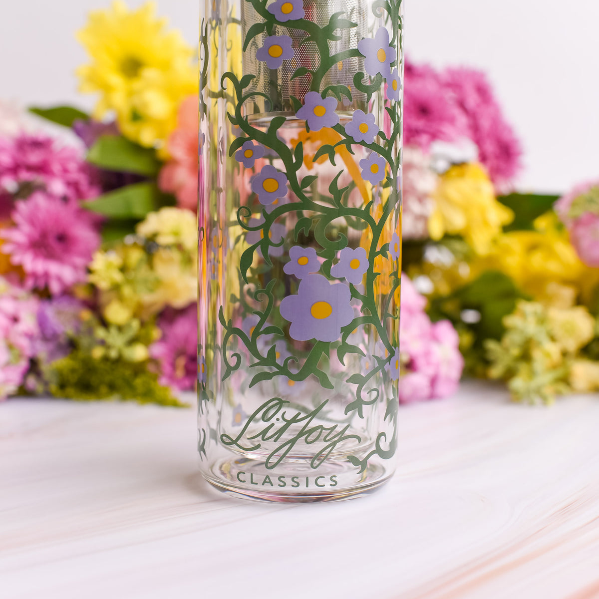 The Secret Garden Glass Water Bottle with bamboo lid and purple flower and key design 