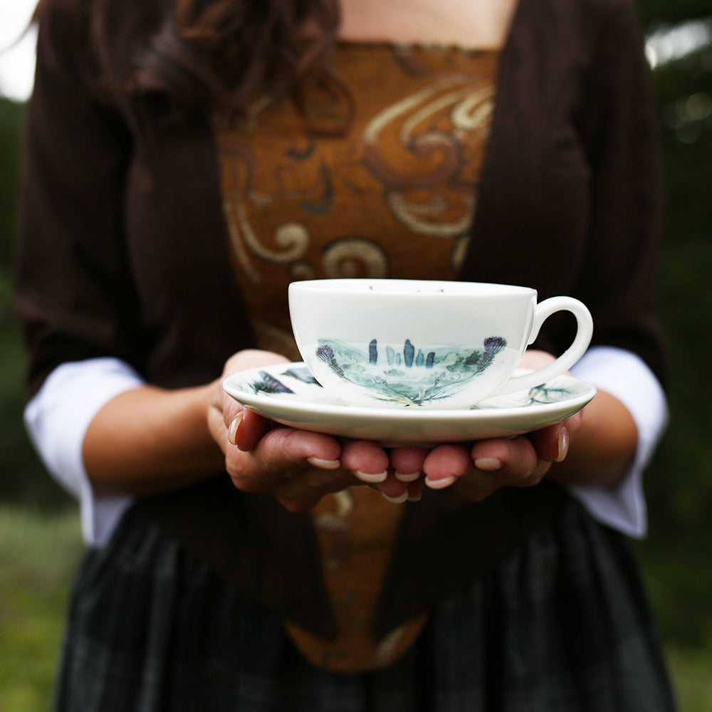 Sassenach Crate Teacup and saucer is white with a purple flower design