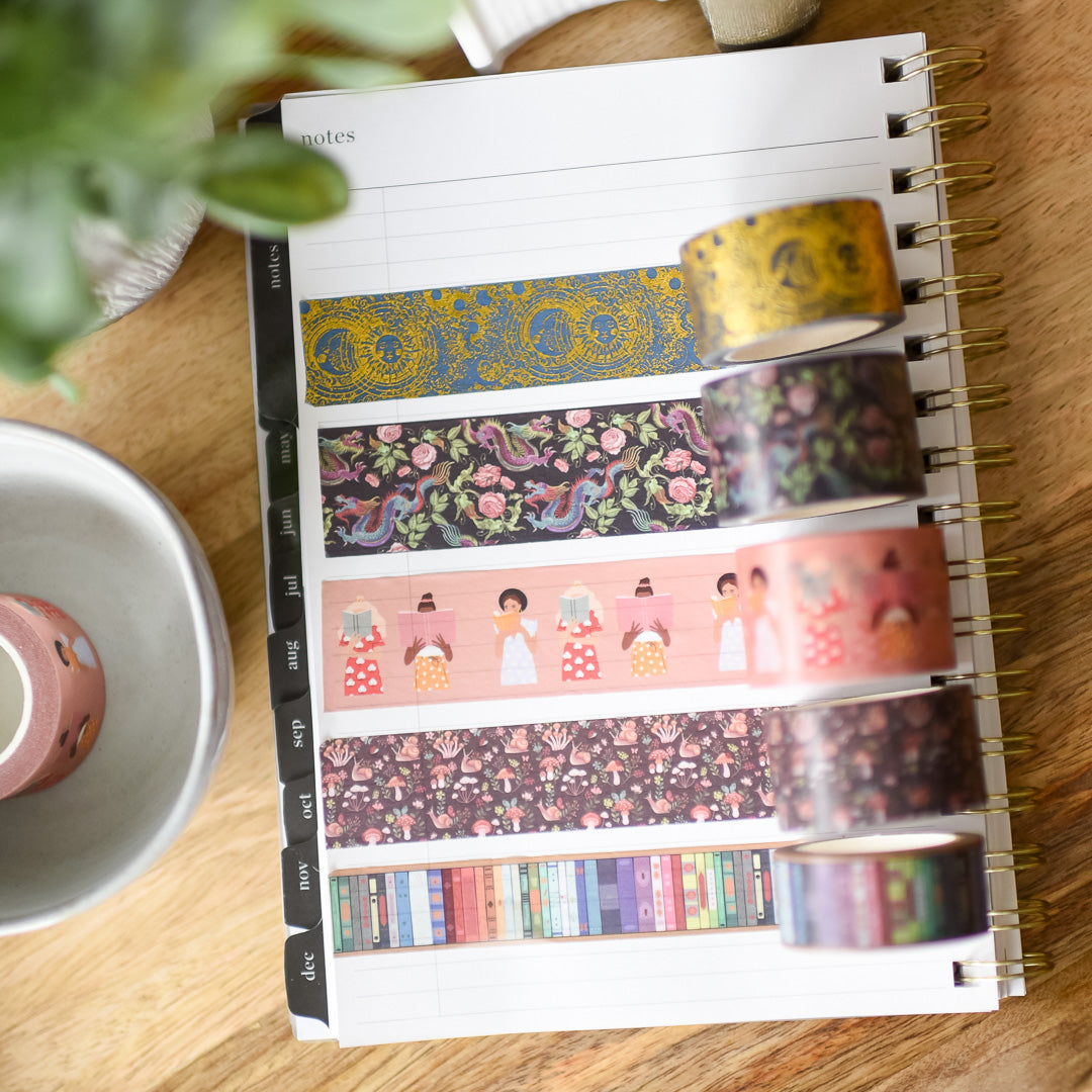 Patterned Washi Tape in 5 different designs: constellations with gold foil, dragons, snails, women reading, and bookshelf
