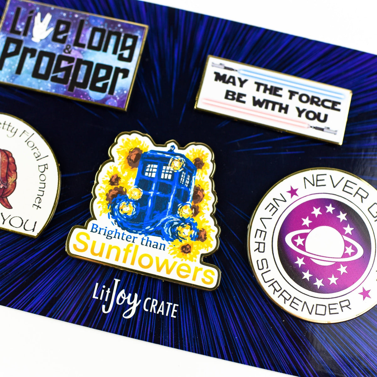 5 Sci Fi Enamel Magnets wthat say: Live Long and Prosper, May the force be with you, I swear by my pretty floral bonnet I will end you, Brighter than sunflowers, and Never give up, never surrender.