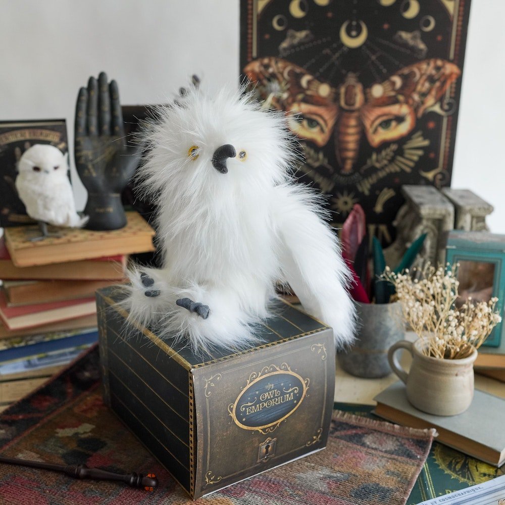 Adopt a Magical White Owl Plush is an owl stuffed animal sitting on his box cage 