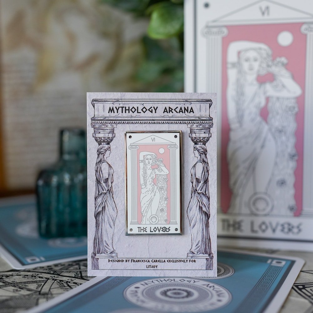 Aphrodite The Lovers, Mythology Tarot Enamel Pin with Aphrodite between two columns and the words &quot;The Lovers” below.
