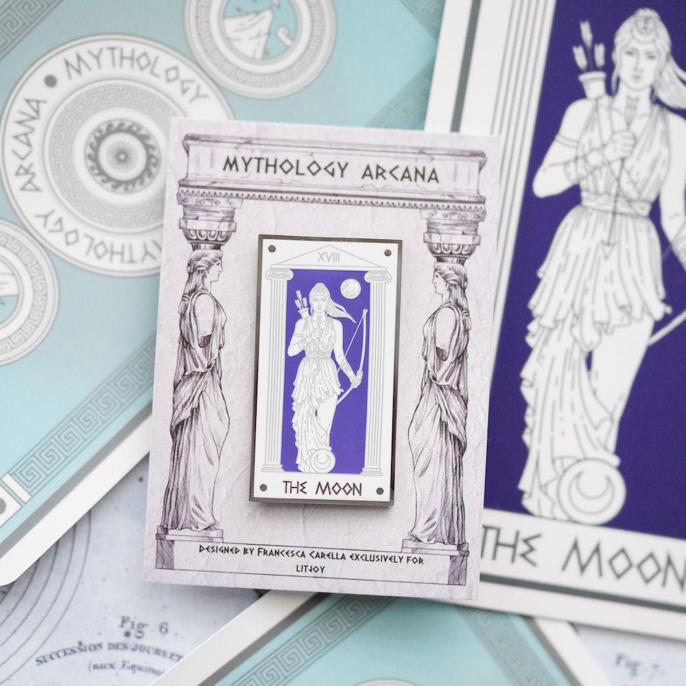 Artemis, The Moon, Mythology Tarot Enamel Pin with her bow ready for a moonlit hunt, appears on a midnight blue background.
