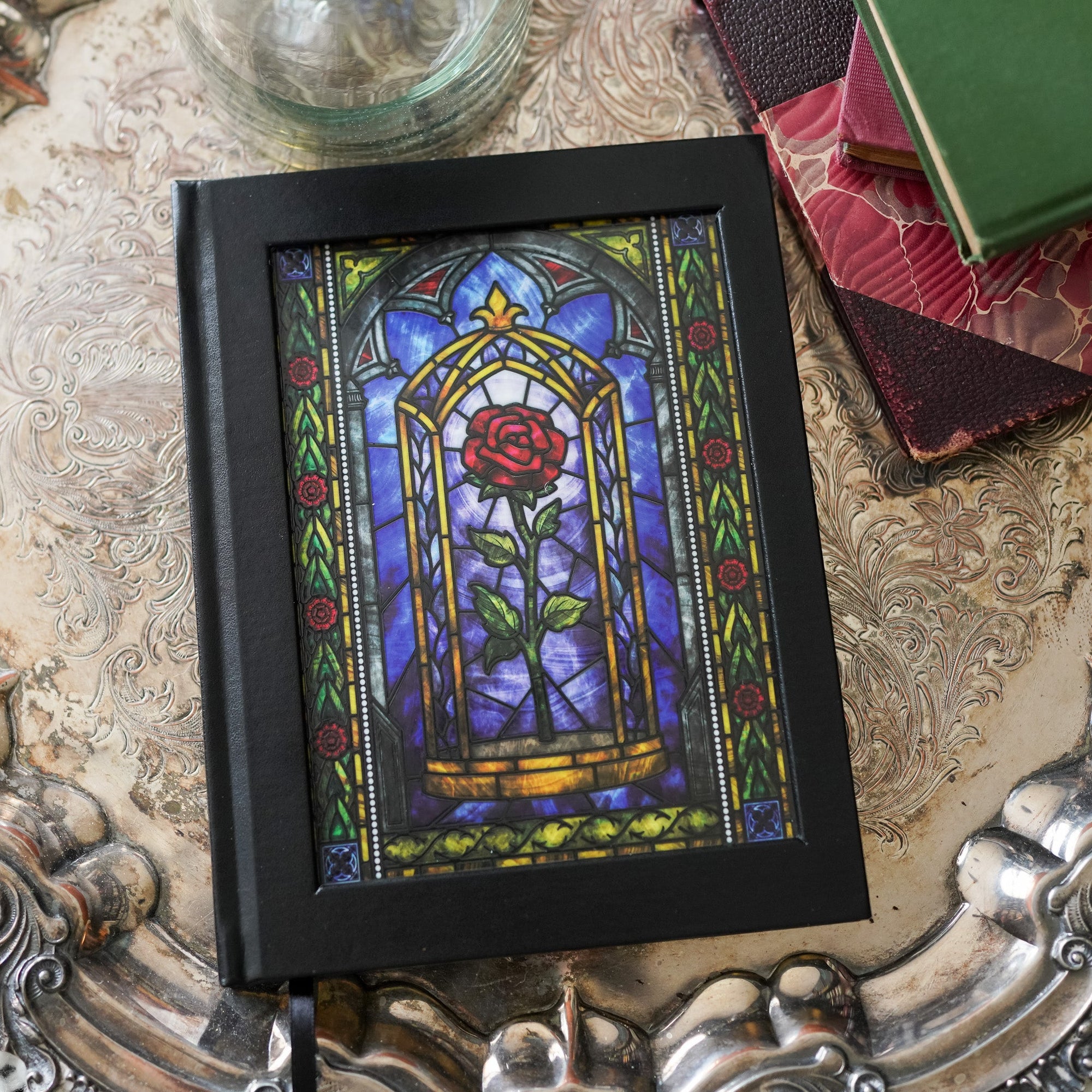 Beauty and the Beast Fairytale Notebook with a rose in stained-glass art on the cover