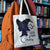 A canvas book tote with a witch silhouette adorned with gold stars. The tote reads Book Club Coven; "club" is crossed out.