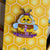 Bumbledore Bee Enamel Pin is a pin of a bee with gray hair and a beard knitting a purple sock
