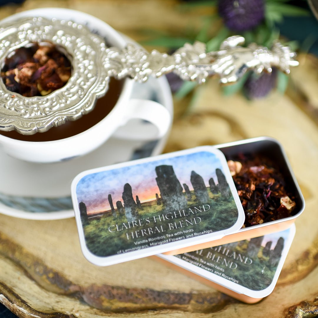 Claire's Highland Blend Tea Tin filled with loose leaf tea and an image on the standing stones on the front