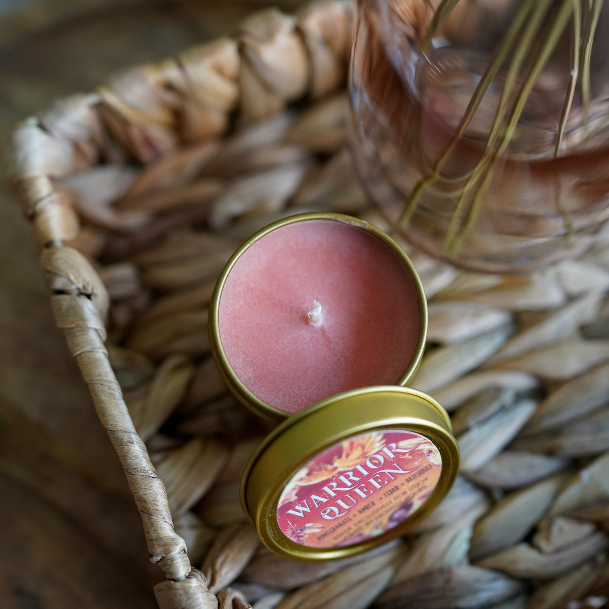Pink Crown of Feathers Candle with a gold lid with &quot;Warrior Queen&quot; on it