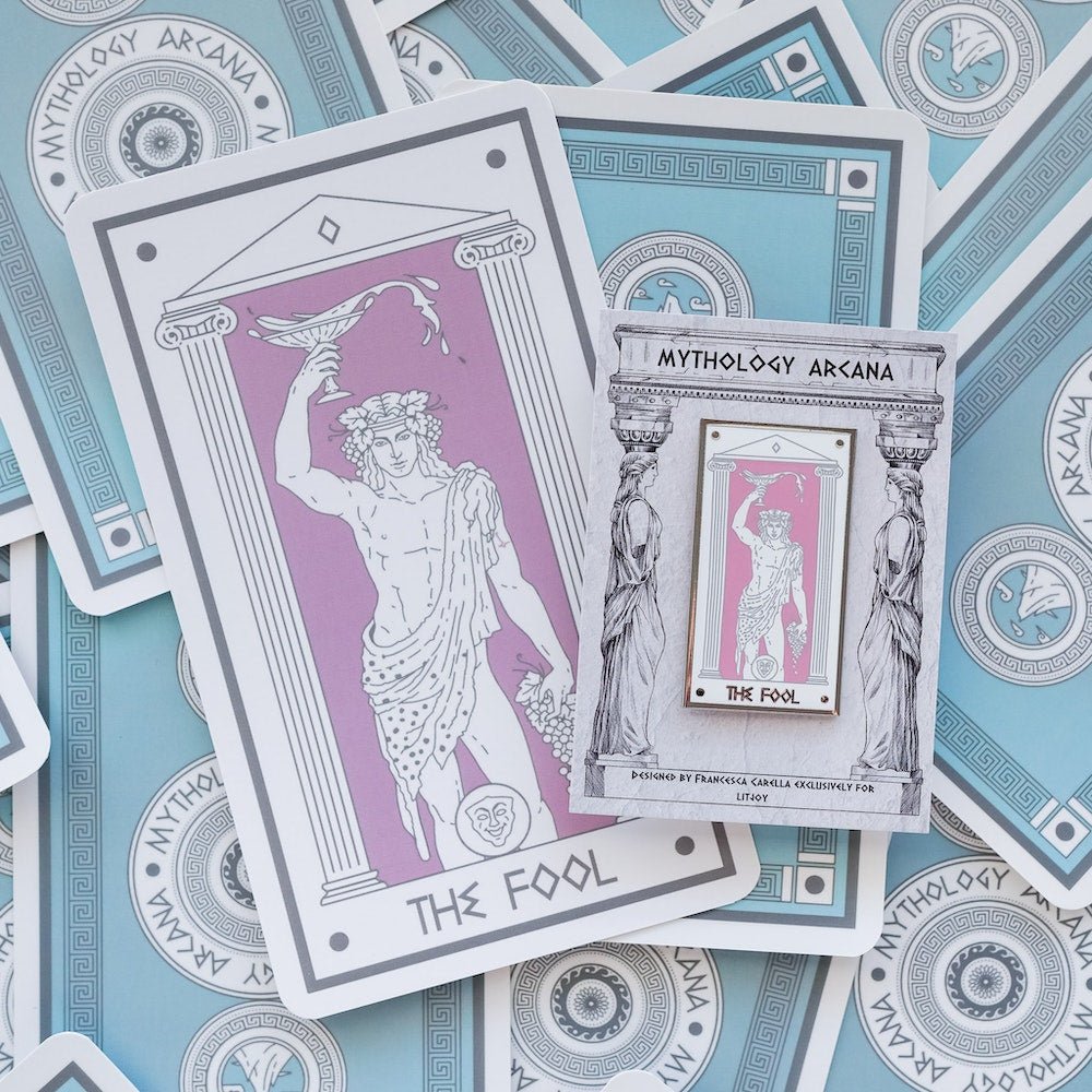 Dionysus the Fool, Mythology Tarot Enamel Pin with Dionysus in white holding grapes in his left hand and a chalice of wine in his right hand.