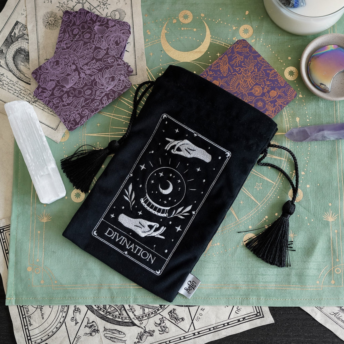 Black Divination Tarot Bag with white embroidery of a crystal ball with two hands above and below.