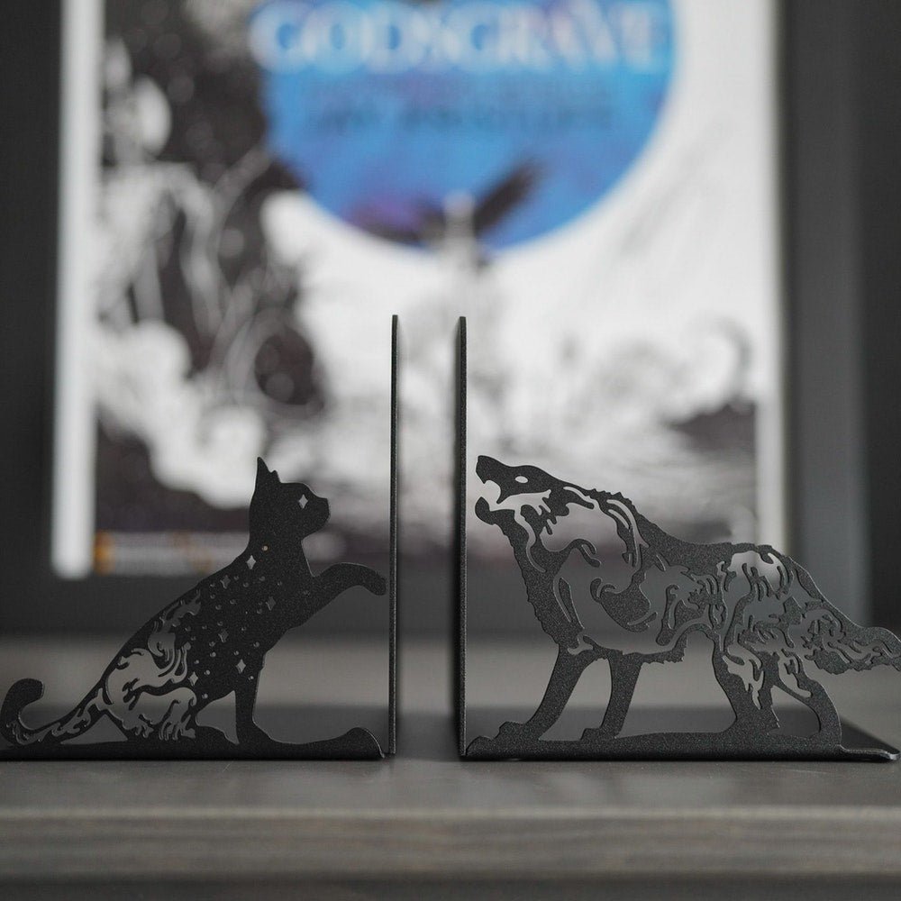 Shadow daemon Eclipse and Mister Kindly Bookends in the shape of a cat and a wolf from Nevernight by Jay Kristoff.