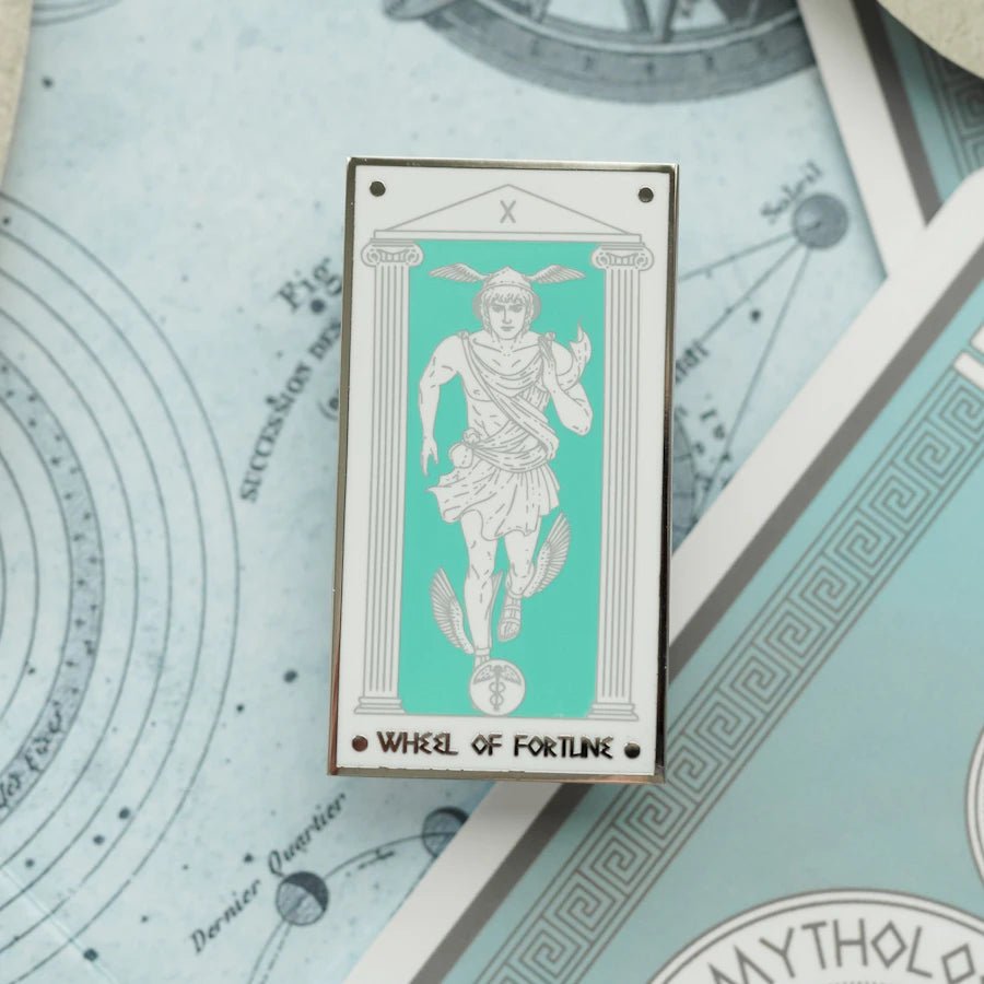 Hermes Wheel of Fortune, Mythology Tarot Enamel Pin shows Hermes running, adorned with his helmet, sandals, money pouch, &amp; caduceus symbol.