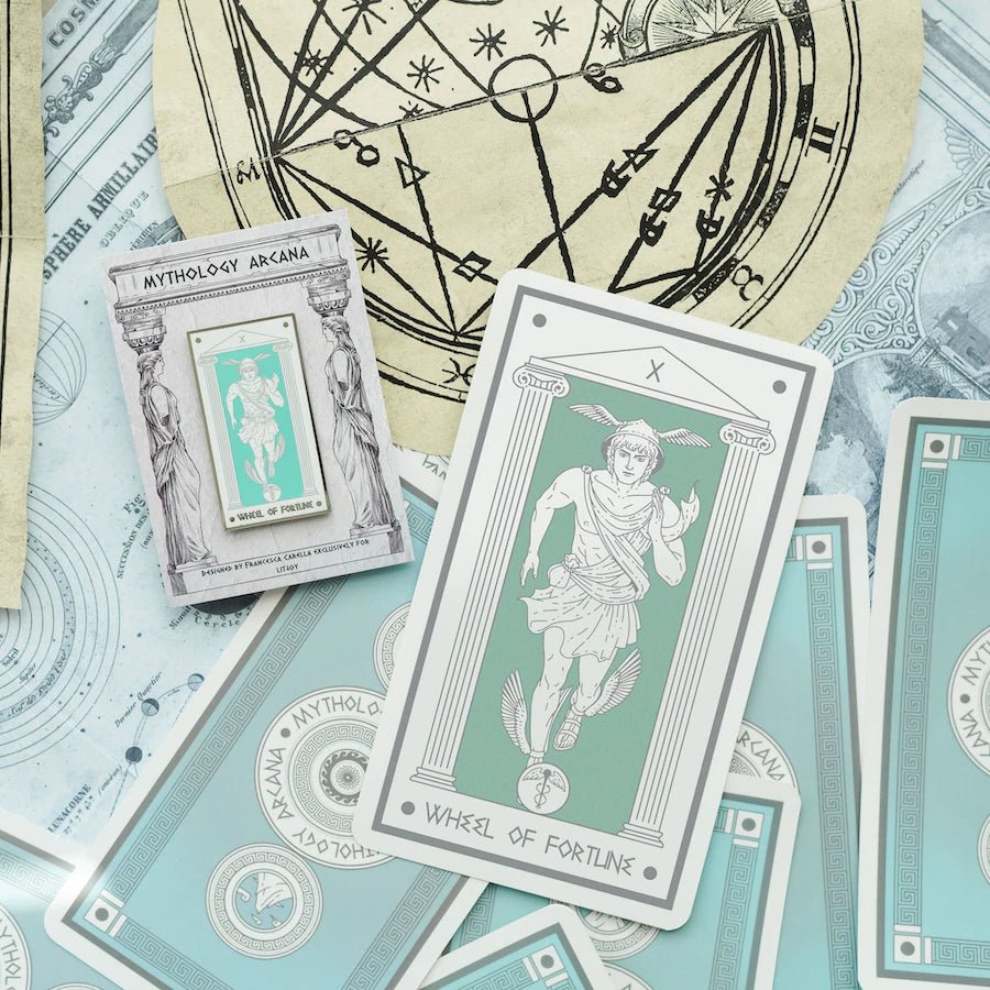 Hermes Wheel of Fortune, Mythology Tarot Enamel Pin shows Hermes running, adorned with his helmet, sandals, money pouch, & caduceus symbol.
