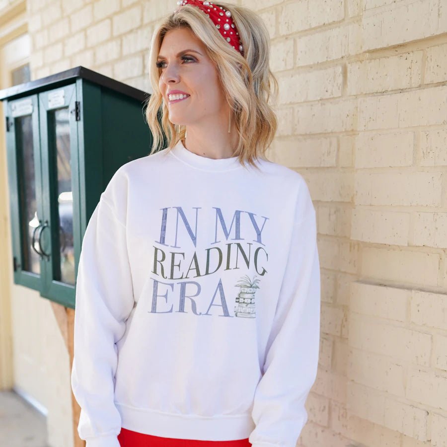The image on the white In My Reading Era Sweatshirt reads &quot;In my reading era&quot; with a stack of books after &quot;era&quot;.